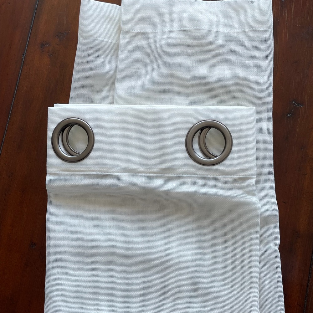 Four Pottery Barn sheer curtain panels